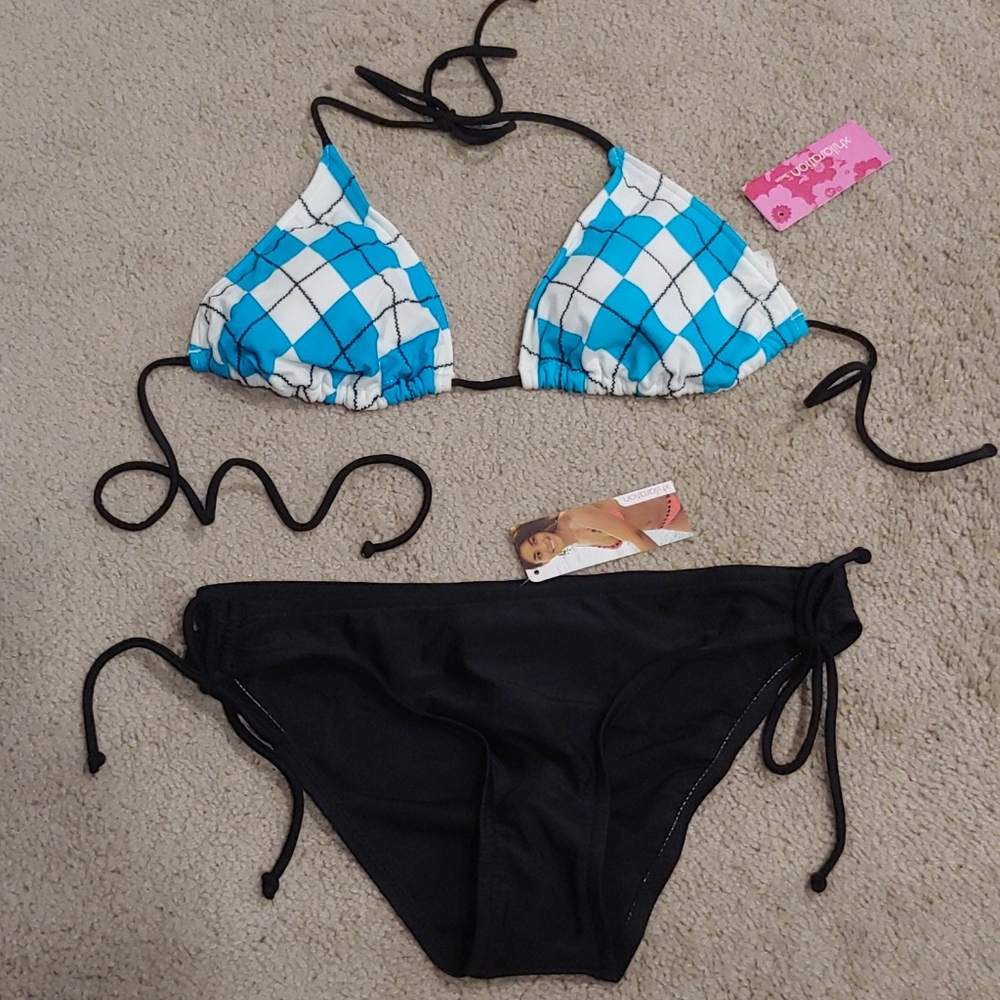 Teal and black binki